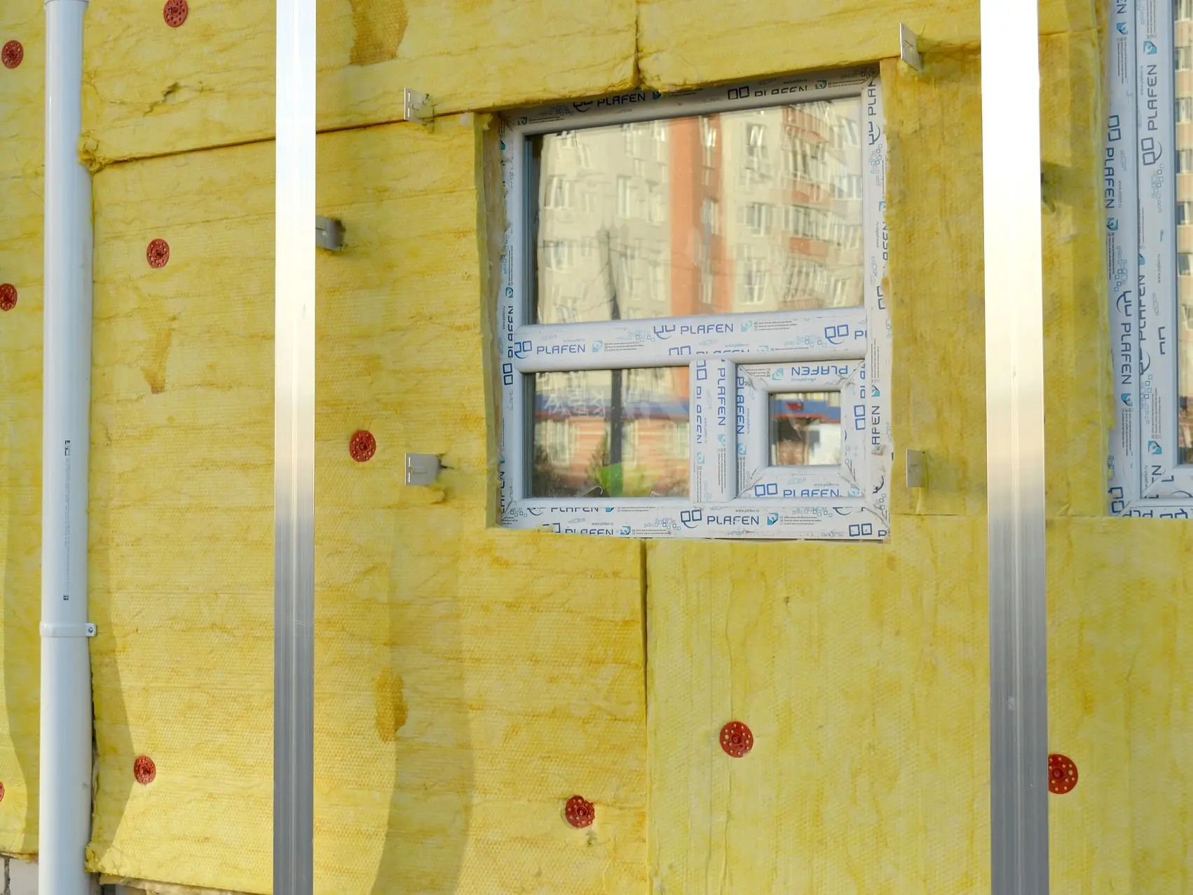 Open insulated walls under construction.