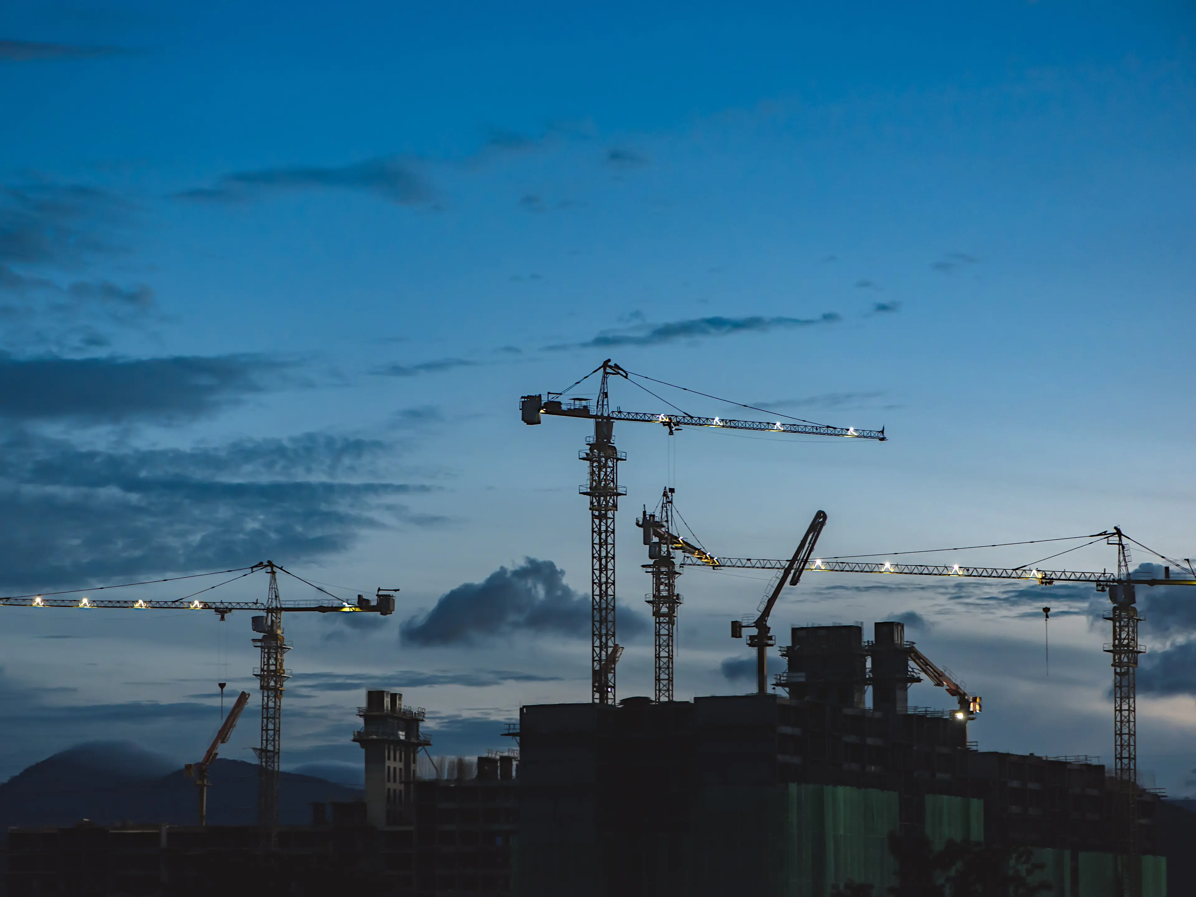 Chemical plant with cranes and buildings.