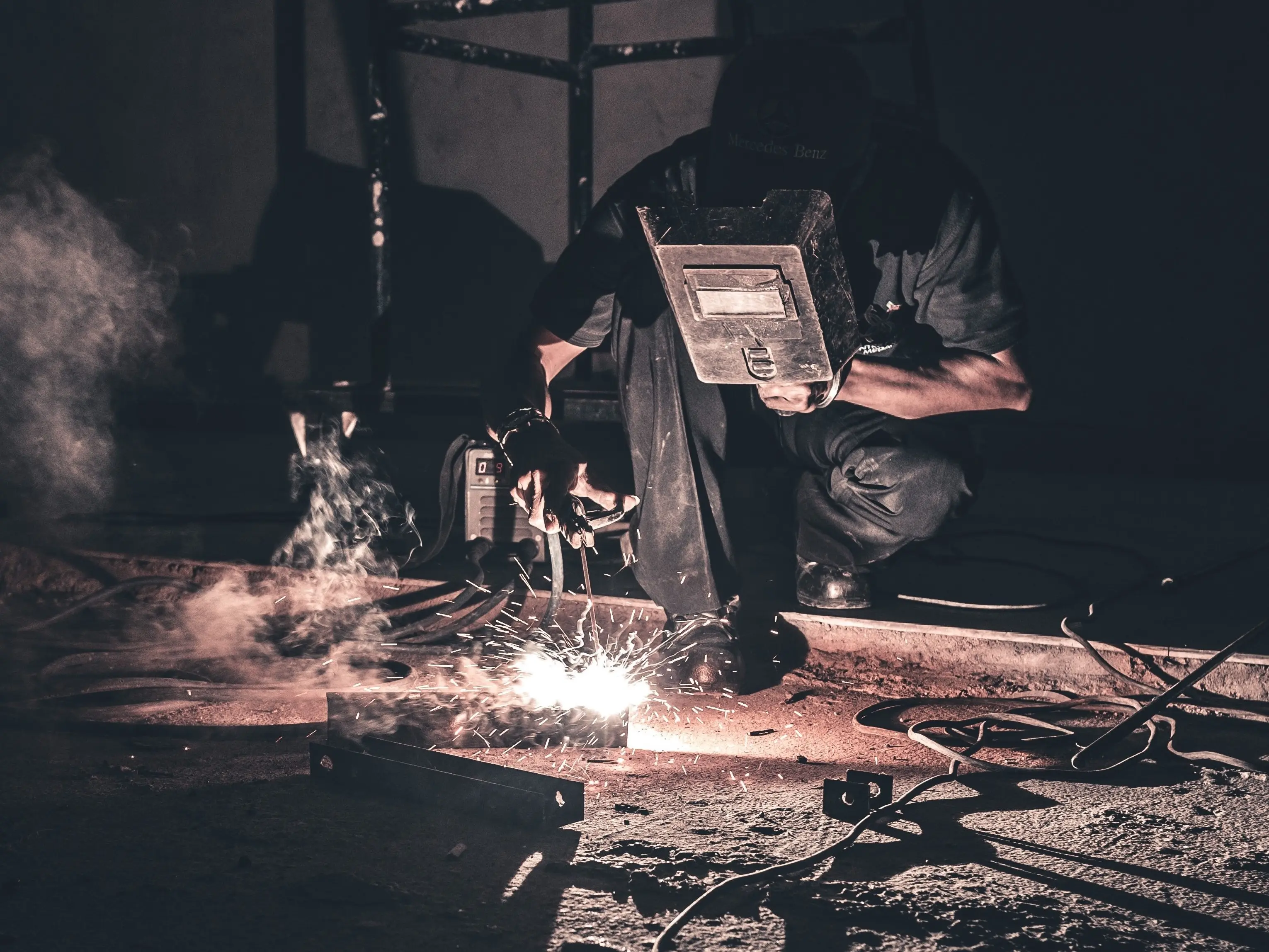 Worker welding in workplace.